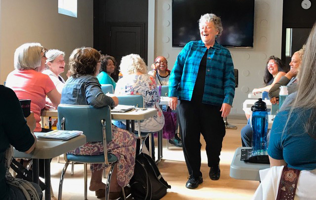 Tina Zion teaching in classroom students laughter